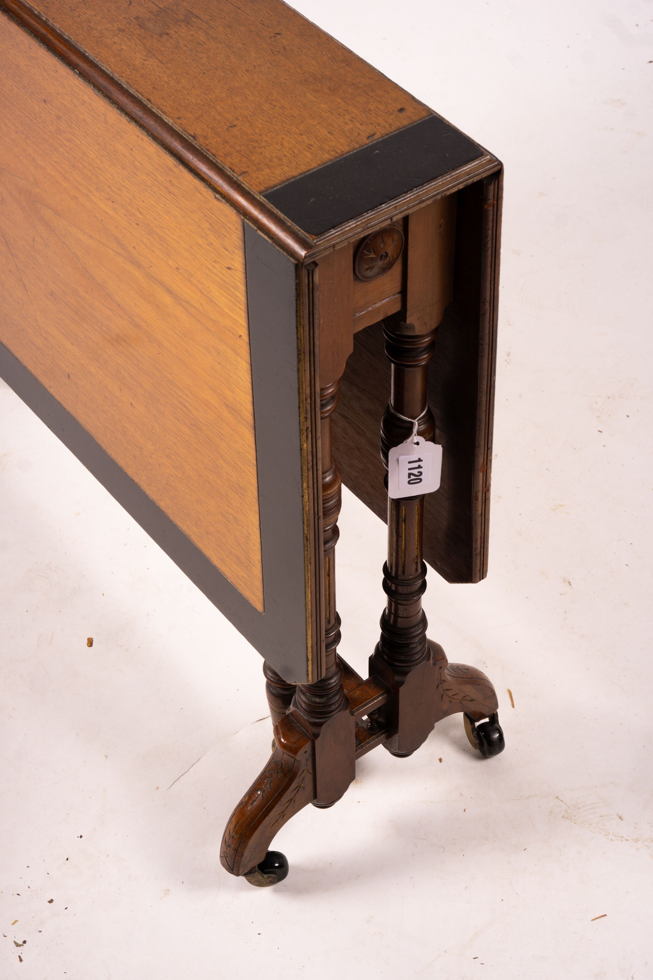 A late Victorian part ebonised walnut Sutherland table, width 76cm, depth 15cm, height 65cm